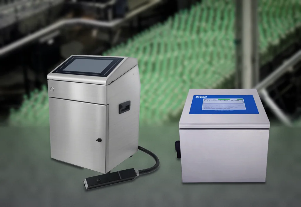 The DaVinci DV-C500 continuous inkjet printer and DV-L500 large-character printer on a factory floor, in front of a bottling line.